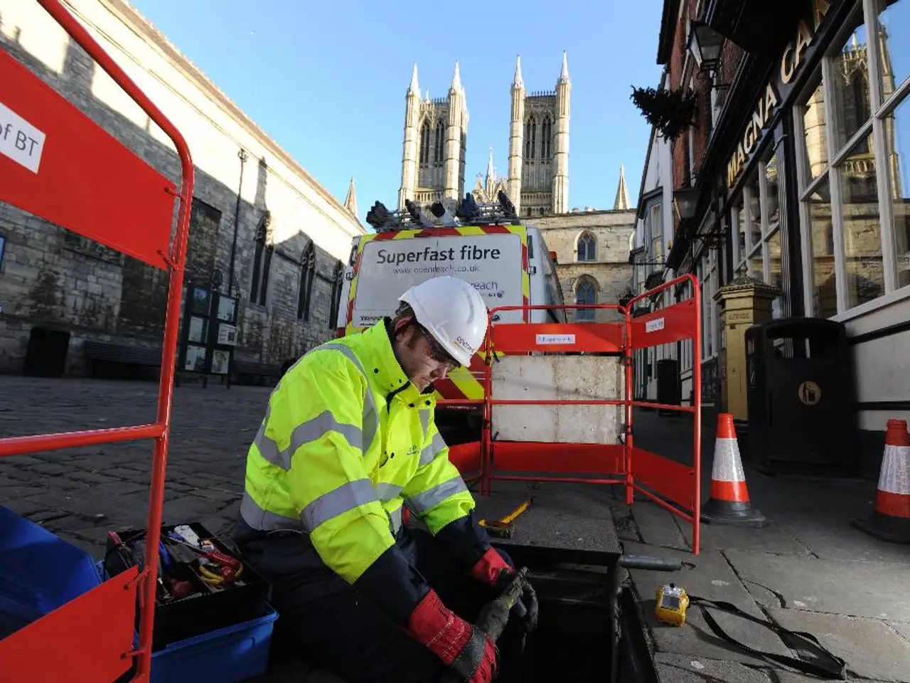 In this image I see a man who is wearing uniform and I see few boards and traffic cones over here...