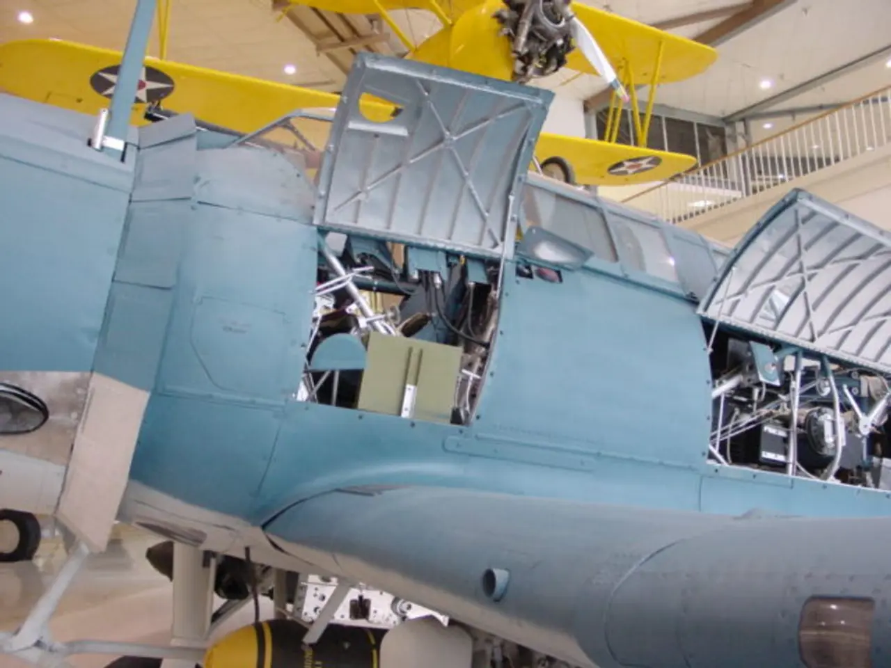 In the picture we can see a part of the aircraft which is blue in color and with its two doors are...