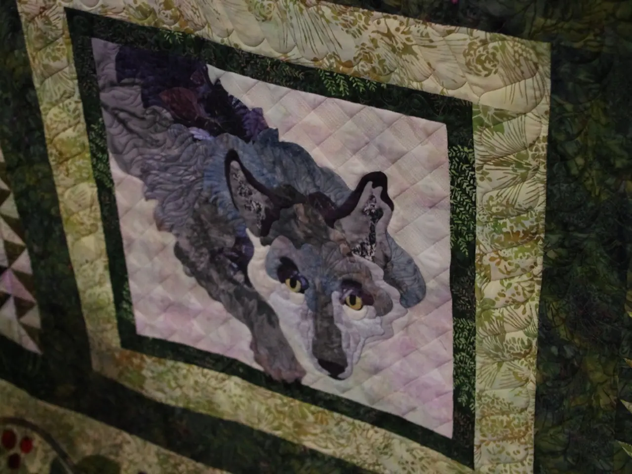 In this image there is a design of an animal on the cloth.