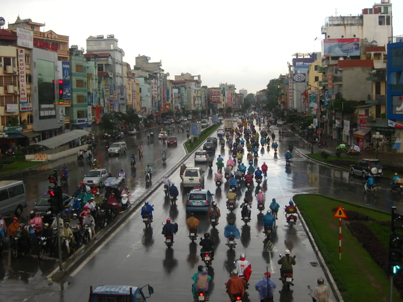 In this image we can see sky, buildings, stores, name boards, sheds, trees, ground, persons on the...