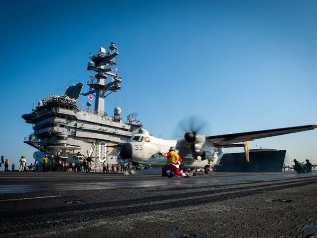 In the image there is an airplane going on runway with a person running in front of it and in the...