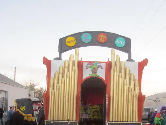 In front of the image there is a truck decorated, in the truck there are some objects, beside the...