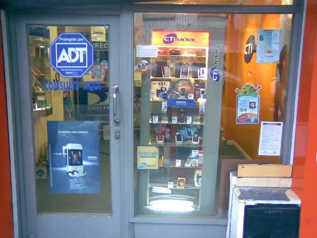 This is a picture of a mobile stall where there are labels stick to the glass , mobiles arranged in...