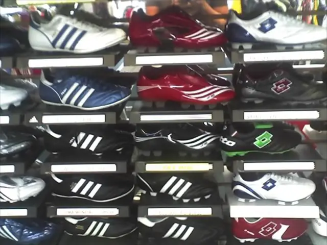 In this image, we can see some shoes kept in the shelves.