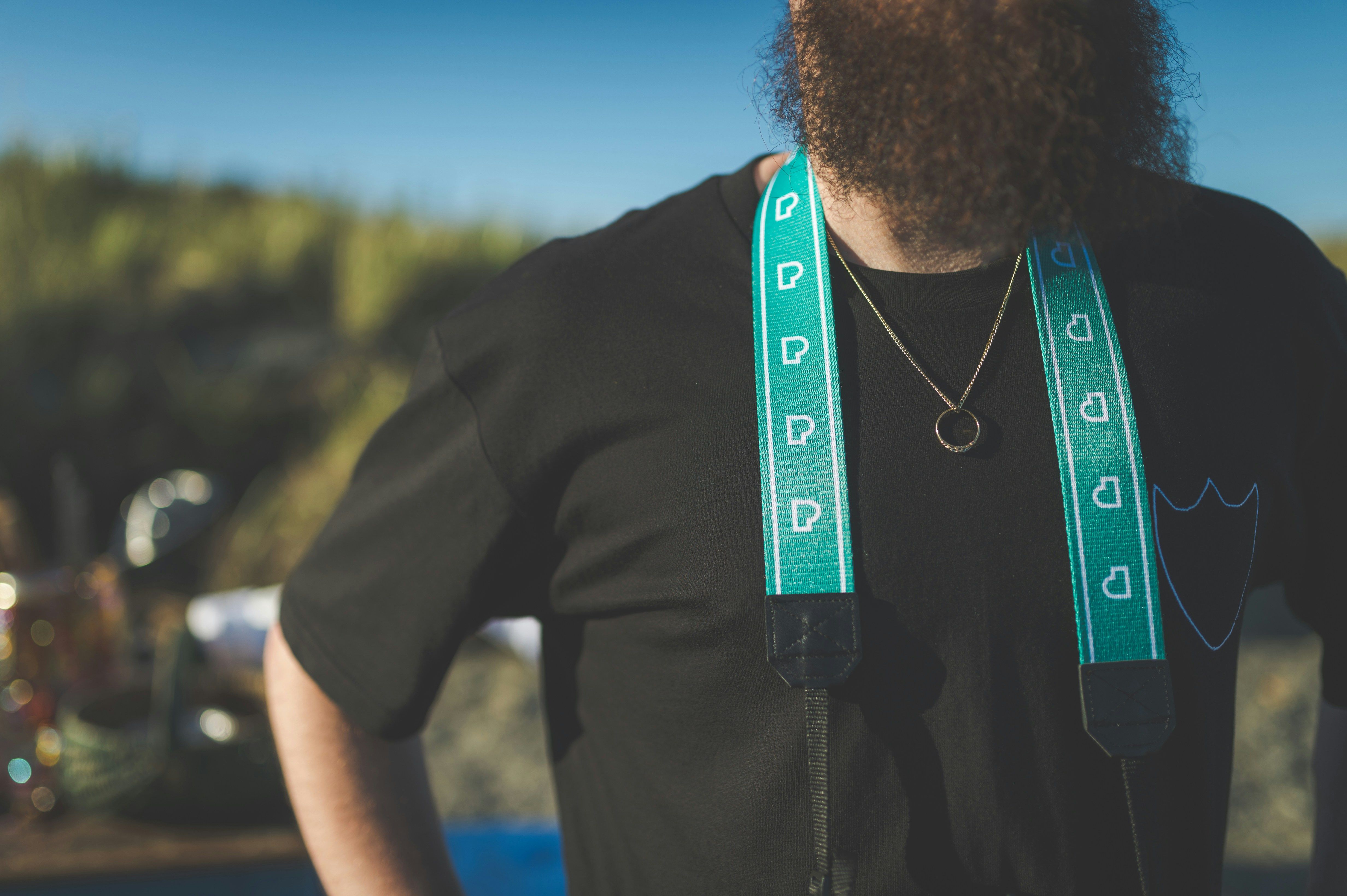 Individual posing with a distinctive red cap brandishing a controversial slogan emblematic of a prominent political movement. Staking LINK tokens becomes profitable with Chainlink's new rewards initiative, dispensing partner project tokens, commencement set for May 8, featuring the allocation of 200 million SXT tokens from Space and Time.