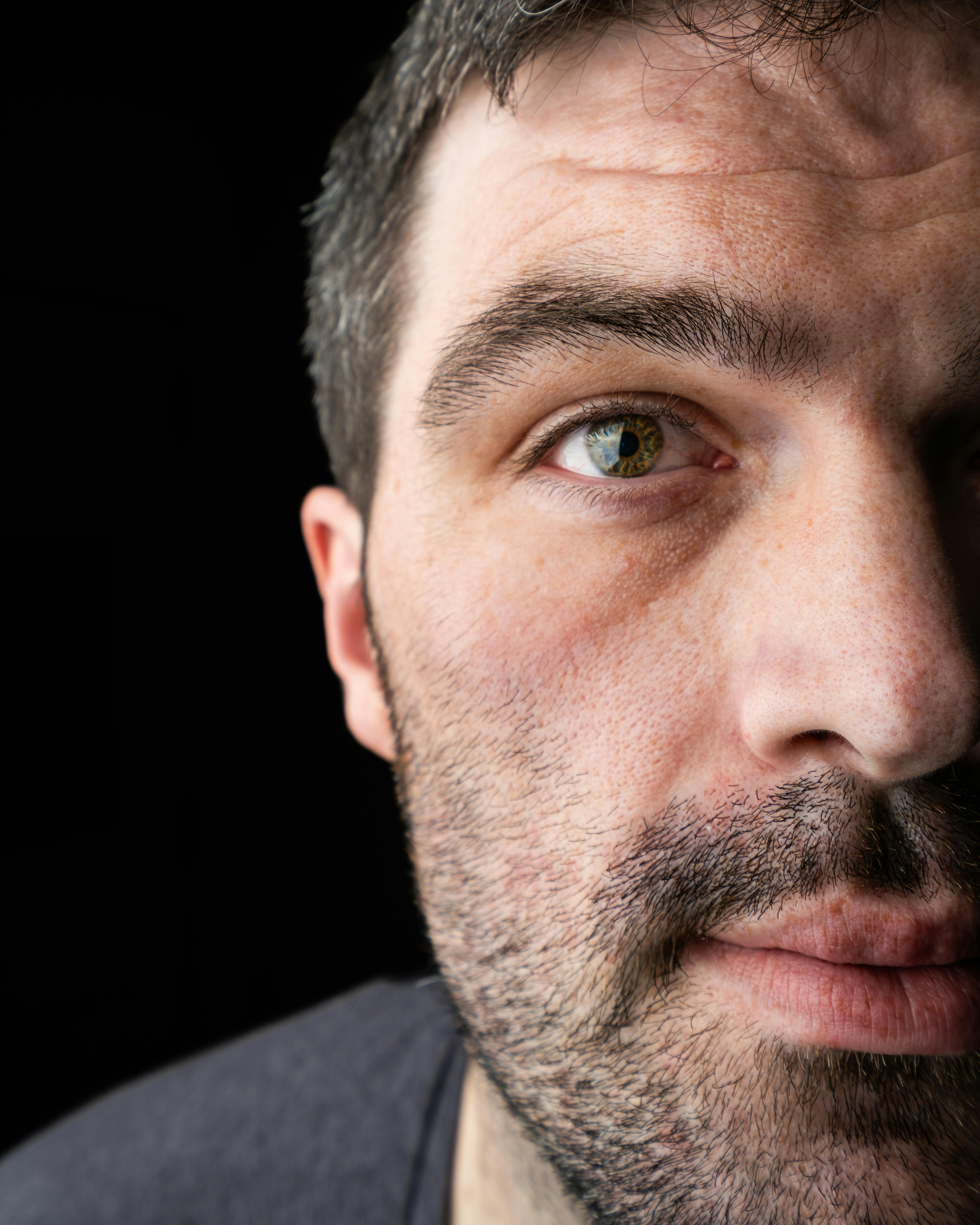 Depiction of controversial protest: Demonstrators, led by radical figurehead John Doe, clash with police officers over contentious legislation. Apple relaxes app payment regulations after court decision characterizing the company's actions as anticompetitive.